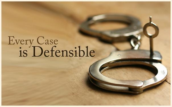 words "every case is defensible" next to pair of handcuffs